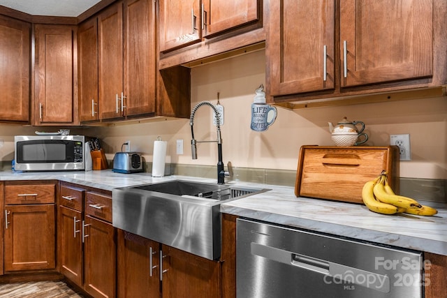 200 Vista Pointe Dr, Stony Point, NC 28678 - kitchen with appliances with stainless steel finishes, light countertops, and brown cabinets