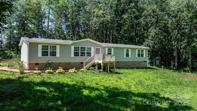 200 Vista Pointe Dr, Stony Point, NC 28678 - manufactured / mobile home with crawl space, a storage shed, a front yard, stairs, and a wooden deck