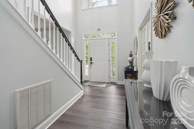 9954 Mitchell Glen Dr, Charlotte, NC 28277 - foyer entrance featuring plenty of natural light, a towering ceiling, stairway, and dark wood-style floors