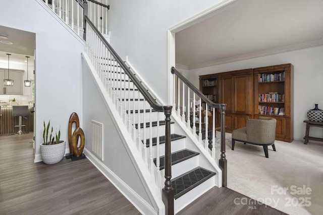 9954 Mitchell Glen Dr, Charlotte, NC 28277 - stairs featuring wood finished floors and ornamental molding