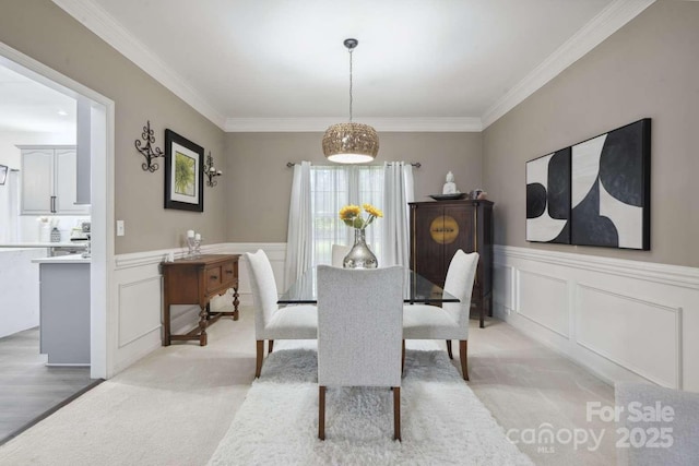 9954 Mitchell Glen Dr, Charlotte, NC 28277 - dining area featuring light colored carpet, ornamental molding, wainscoting, and a decorative wall