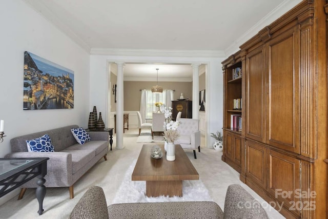 9954 Mitchell Glen Dr, Charlotte, NC 28277 - living area featuring decorative columns, light colored carpet, ornamental molding, and a chandelier