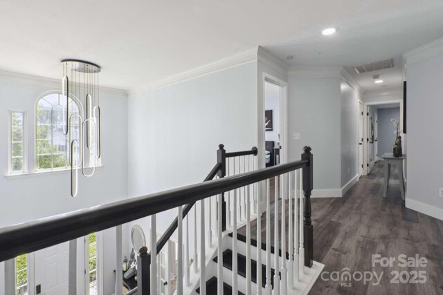 9954 Mitchell Glen Dr, Charlotte, NC 28277 - hallway with an upstairs landing, ornamental molding, dark wood finished floors, and recessed lighting
