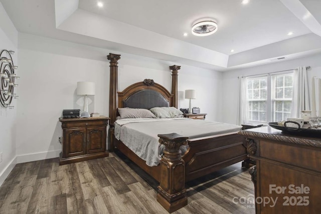 9954 Mitchell Glen Dr, Charlotte, NC 28277 - bedroom featuring a raised ceiling, dark wood-style flooring, and recessed lighting