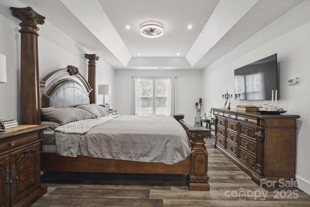 9954 Mitchell Glen Dr, Charlotte, NC 28277 - bedroom with dark wood-style floors, a raised ceiling, and recessed lighting