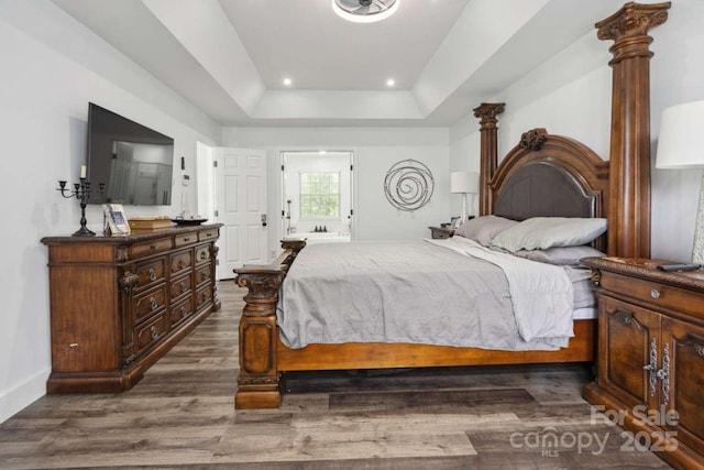9954 Mitchell Glen Dr, Charlotte, NC 28277 - bedroom with dark wood-type flooring, a raised ceiling, and recessed lighting
