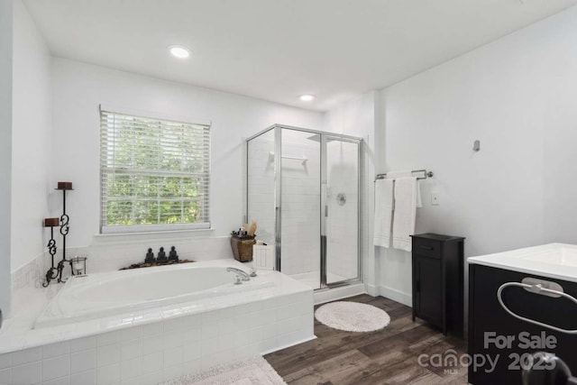 9954 Mitchell Glen Dr, Charlotte, NC 28277 - bathroom featuring a garden tub, a shower stall, vanity, wood finished floors, and recessed lighting
