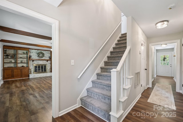 10206 Washam Potts Rd, Cornelius, NC 28031 - foyer with stairs and dark wood-style flooring