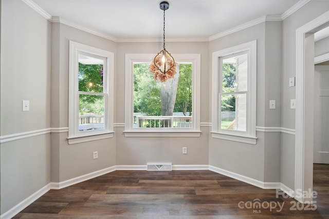10206 Washam Potts Rd, Cornelius, NC 28031 - unfurnished dining area with dark wood-style flooring and crown molding