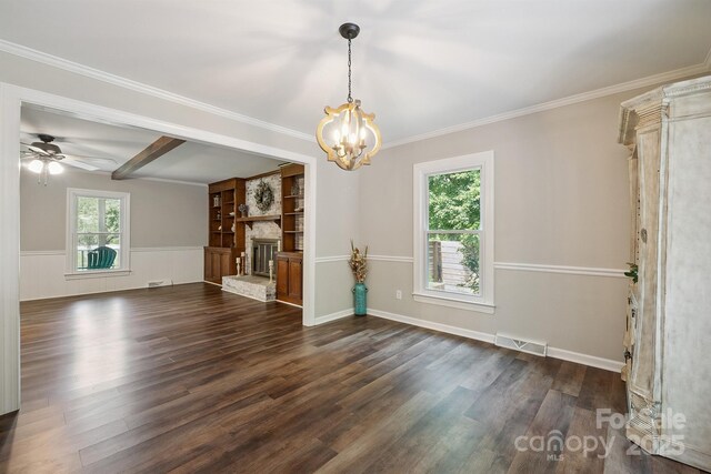 10206 Washam Potts Rd, Cornelius, NC 28031 - unfurnished living room with a chandelier, dark wood-style floors, a stone fireplace, crown molding, and a wainscoted wall