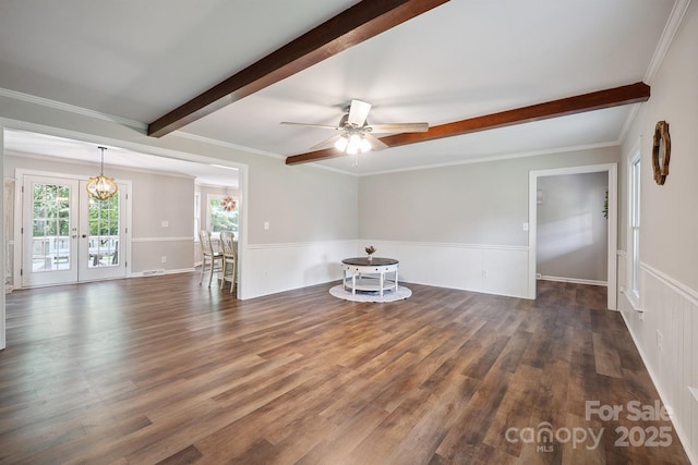 10206 Washam Potts Rd, Cornelius, NC 28031 - unfurnished room with beam ceiling, wood finished floors, ceiling fan, wainscoting, and a chandelier