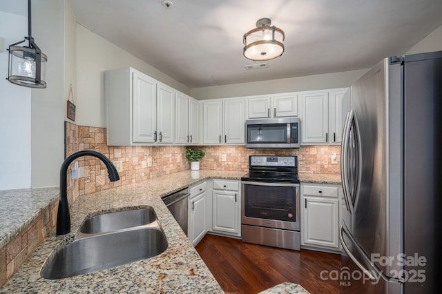 1018 SW Dr SW Unit 18, Davidson, NC 28036 - kitchen with stainless steel appliances, dark wood-style flooring, and white cabinets