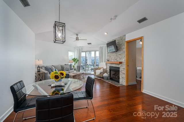 1018 SW Dr SW Unit 18, Davidson, NC 28036 - dining area featuring a ceiling fan, wood finished floors, a stone fireplace, and lofted ceiling