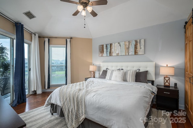 1018 SW Dr SW Unit 18, Davidson, NC 28036 - bedroom featuring a barn door, vaulted ceiling, wood finished floors, access to outside, and a ceiling fan