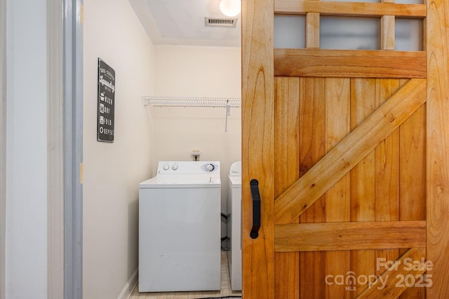 1018 SW Dr SW Unit 18, Davidson, NC 28036 - washroom with washer and dryer and baseboards