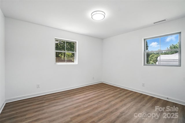 2705 Lowell Bethesda Rd, Gastonia, NC 28056 - unfurnished room featuring healthy amount of natural light and wood finished floors