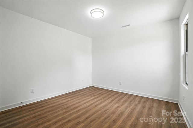 2705 Lowell Bethesda Rd, Gastonia, NC 28056 - unfurnished room featuring dark wood-style floors and baseboards