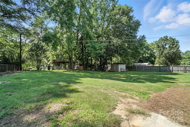 2705 Lowell Bethesda Rd, Gastonia, NC 28056 - fenced backyard with a storage shed and view of wooded area
