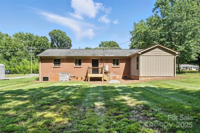 2705 Lowell Bethesda Rd, Gastonia, NC 28056 - back of property featuring a yard, board and batten siding, and crawl space