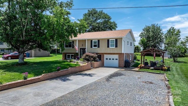 3651 16th St NE, Hickory, NC 28601 - split foyer home with a gazebo, concrete driveway, an attached garage, brick siding, and a front yard