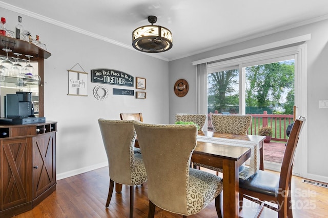 3651 16th St NE, Hickory, NC 28601 - dining area with wood finished floors and crown molding