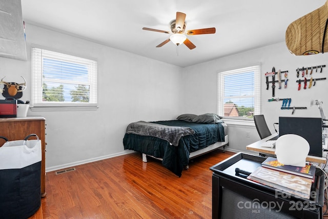 3651 16th St NE, Hickory, NC 28601 - bedroom with wood finished floors, a ceiling fan, and an office area