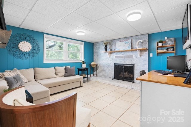 3651 16th St NE, Hickory, NC 28601 - living room featuring a paneled ceiling, light tile patterned floors, and a fireplace