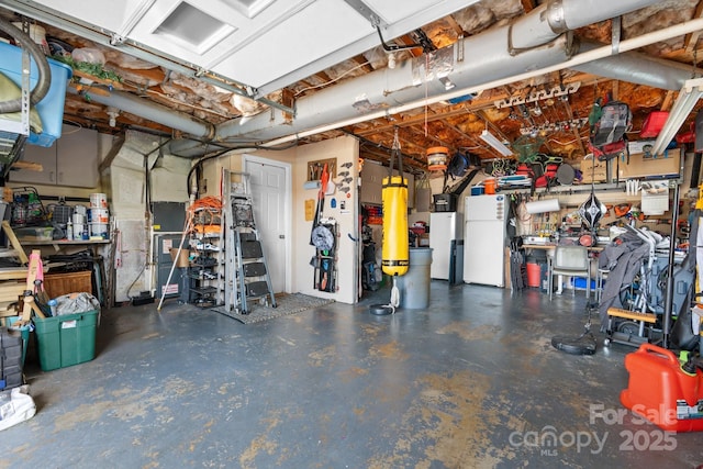 3651 16th St NE, Hickory, NC 28601 - garage featuring a workshop area and freestanding refrigerator