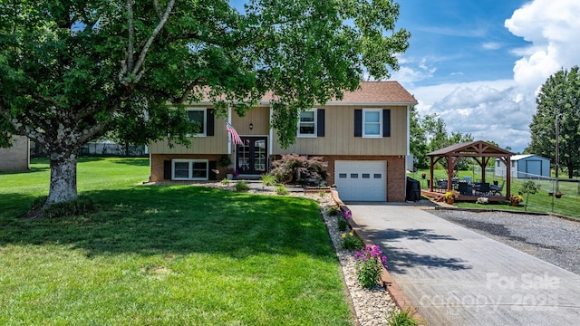 3651 16th St NE, Hickory, NC 28601 - raised ranch with driveway, an attached garage, brick siding, a front lawn, and a gazebo