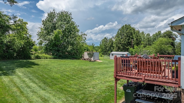 3651 16th St NE, Hickory, NC 28601 - view of grassy yard featuring a shed and a wooden deck