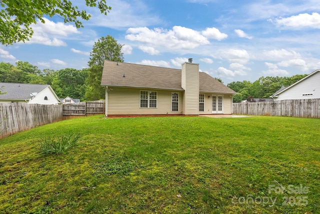 385 Glensprings Dr Unit 269, Fletcher, NC 28732 - rear view of property featuring a fenced backyard, a chimney, a patio area, and french doors
