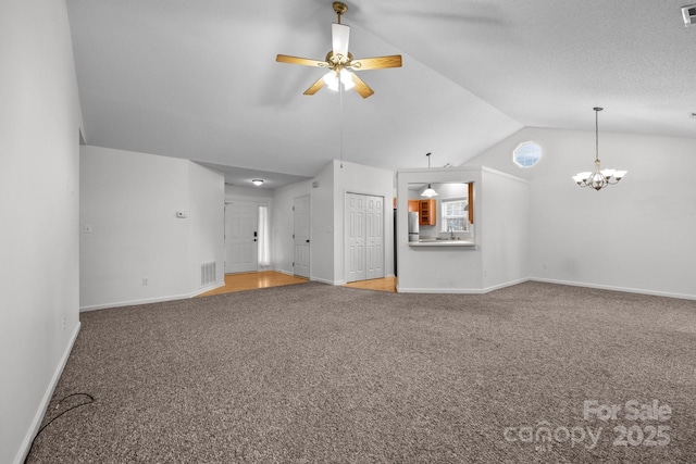 385 Glensprings Dr Unit 269, Fletcher, NC 28732 - unfurnished living room with carpet floors, vaulted ceiling, a ceiling fan, and a chandelier