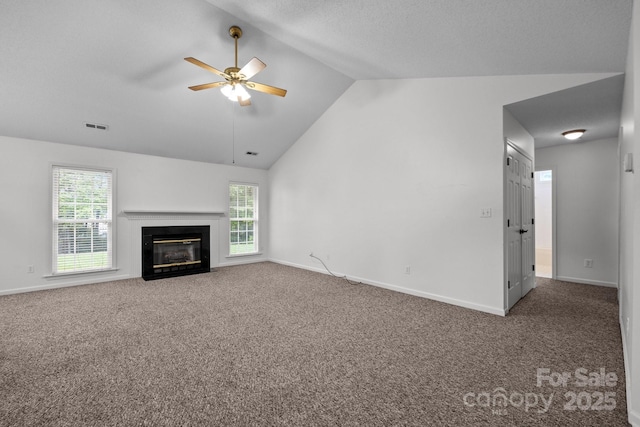 385 Glensprings Dr Unit 269, Fletcher, NC 28732 - unfurnished living room with vaulted ceiling, carpet flooring, a ceiling fan, and a fireplace with flush hearth
