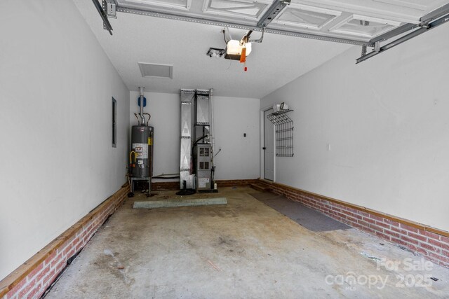 385 Glensprings Dr Unit 269, Fletcher, NC 28732 - garage with heating unit, gas water heater, and a garage door opener