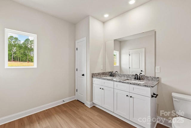 7106 Jerimoth Dr, Charlotte, NC 28215 - bathroom featuring wood finished floors, double vanity, and recessed lighting