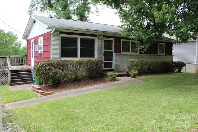 50 Huffman Rd, Asheville, NC 28806 - ranch-style home with a front lawn, a wooden deck, brick siding, and cooling unit