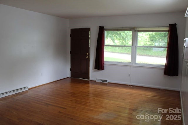50 Huffman Rd, Asheville, NC 28806 - spare room featuring wood finished floors and baseboard heating