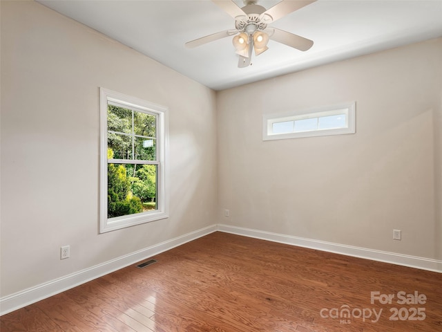 78 W Chapel Rd, Asheville, NC 28803 - spare room with healthy amount of natural light, dark wood-style floors, and a ceiling fan