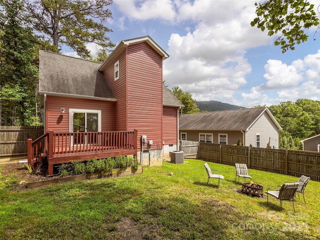 78 W Chapel Rd, Asheville, NC 28803 - rear view of property featuring an outdoor fire pit, a deck, roof with shingles, and a fenced backyard