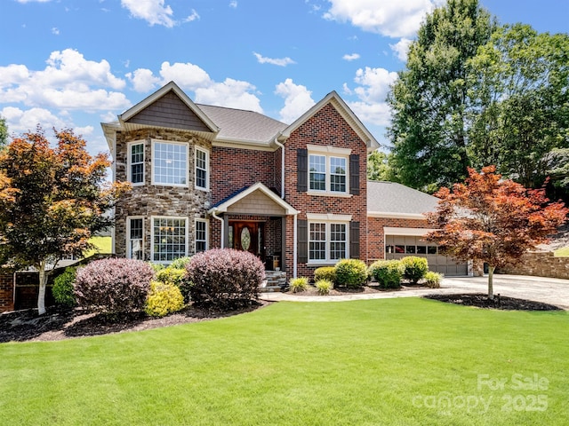 165 Cottontail Ln SE, Concord, NC 28025 - traditional-style home featuring a front lawn, driveway, an attached garage, stone siding, and brick siding