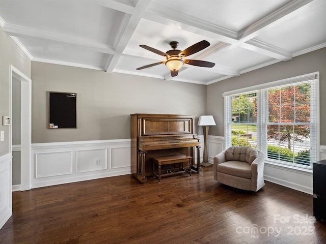 165 Cottontail Ln SE, Concord, NC 28025 - living area featuring coffered ceiling, dark wood-style flooring, ceiling fan, beamed ceiling, and wainscoting