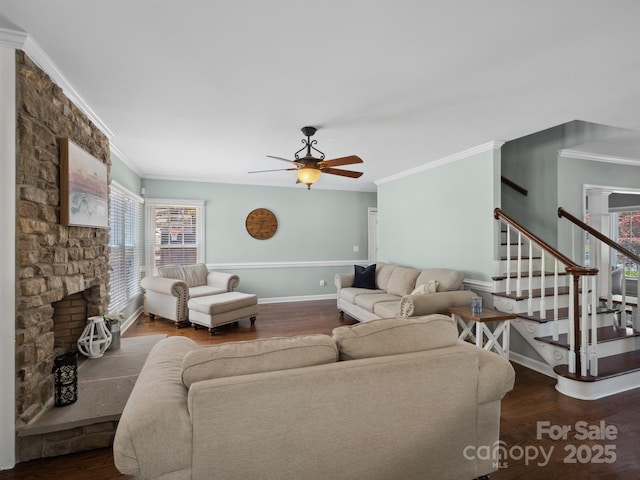 165 Cottontail Ln SE, Concord, NC 28025 - living room featuring crown molding, ceiling fan, wood finished floors, and stairs