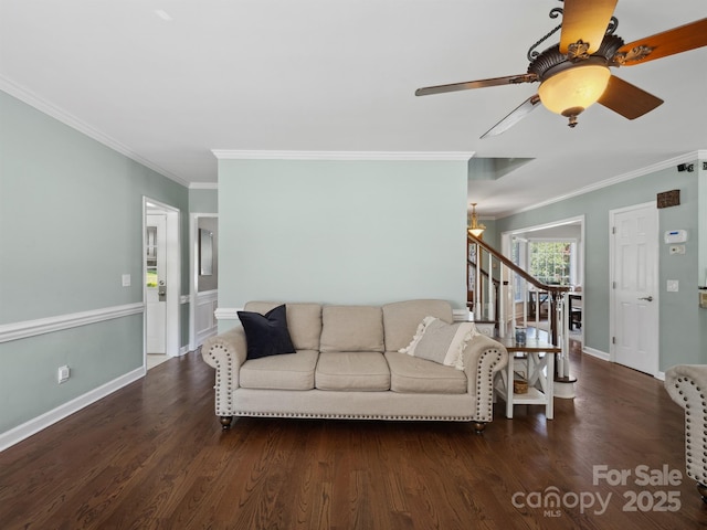165 Cottontail Ln SE, Concord, NC 28025 - living room with crown molding, stairway, wood finished floors, and a ceiling fan