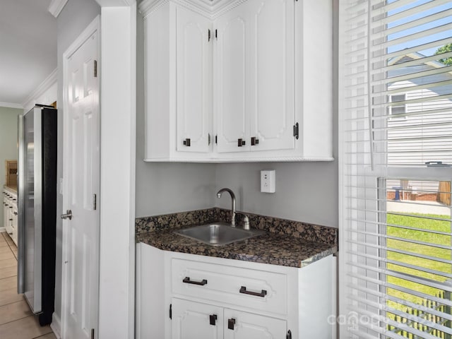 165 Cottontail Ln SE, Concord, NC 28025 - indoor wet bar with ornamental molding, freestanding refrigerator, and light tile patterned floors