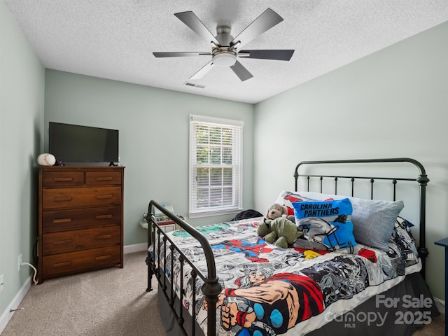 165 Cottontail Ln SE, Concord, NC 28025 - bedroom featuring carpet floors, a textured ceiling, and a ceiling fan