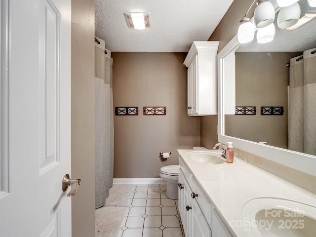 165 Cottontail Ln SE, Concord, NC 28025 - full bathroom with double vanity and a textured ceiling