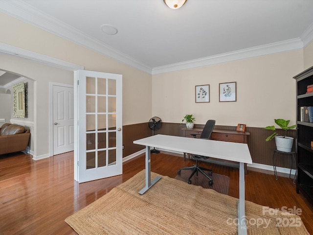 1808 Mill Chase Ln, Waxhaw, NC 28173 - home office with crown molding, wood finished floors, a wainscoted wall, and arched walkways