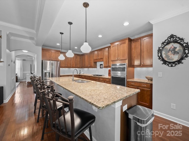 1808 Mill Chase Ln, Waxhaw, NC 28173 - kitchen featuring stainless steel appliances, arched walkways, ornamental molding, light stone countertops, and recessed lighting