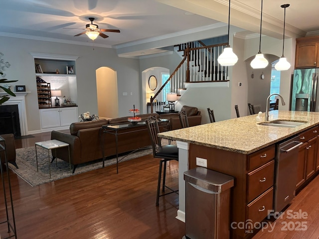 1808 Mill Chase Ln, Waxhaw, NC 28173 - kitchen featuring open floor plan, arched walkways, a ceiling fan, appliances with stainless steel finishes, and dark wood finished floors