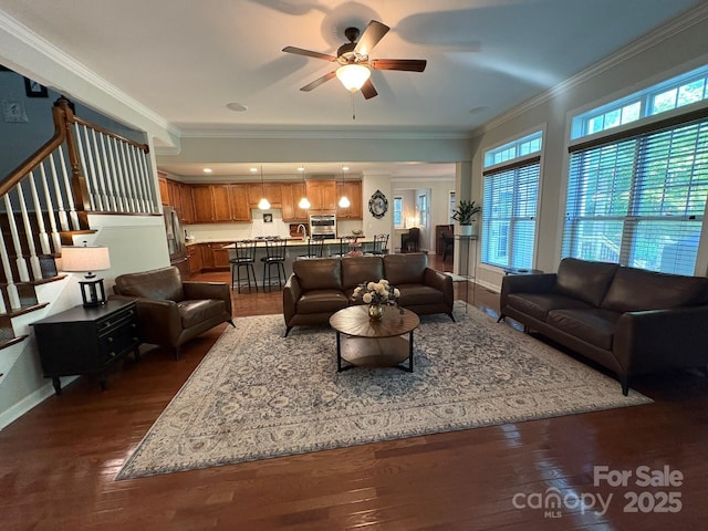 1808 Mill Chase Ln, Waxhaw, NC 28173 - living area with dark wood-style flooring, crown molding, a ceiling fan, and stairs